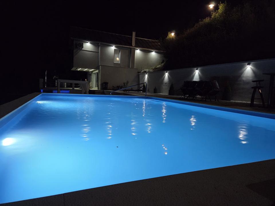 Happyland pool lit at night