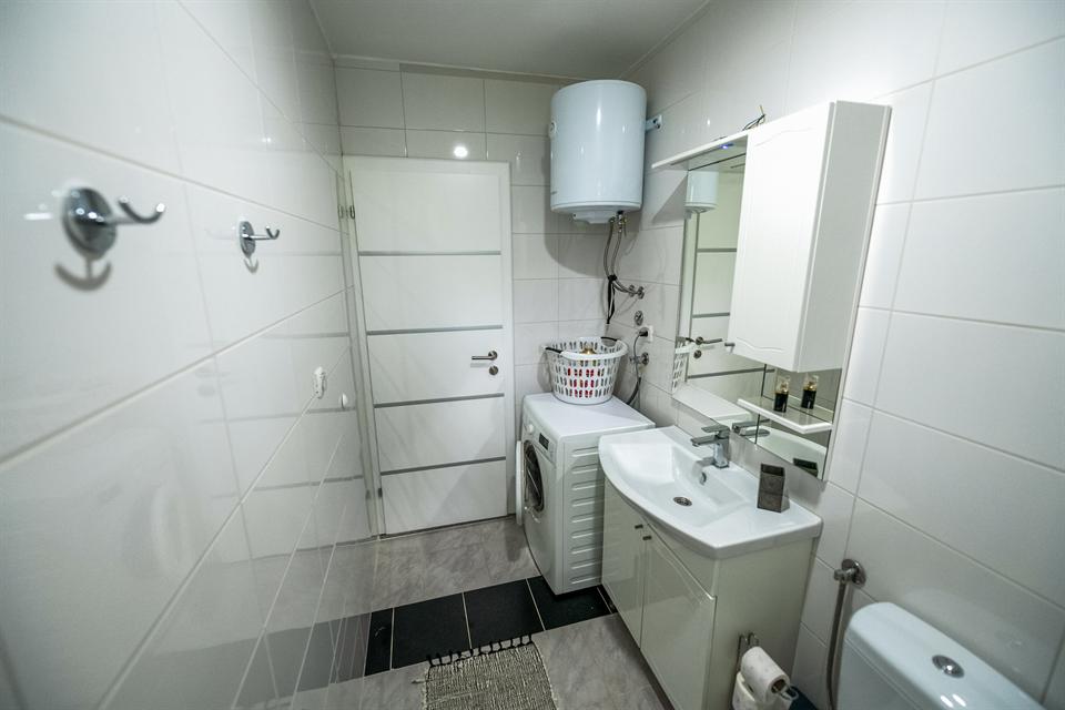 Upstairs bathroom with washing machine