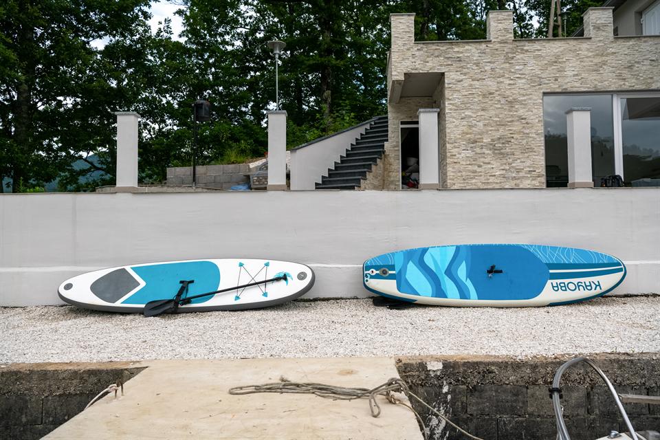 Paddle boards on the Happyland shoreline