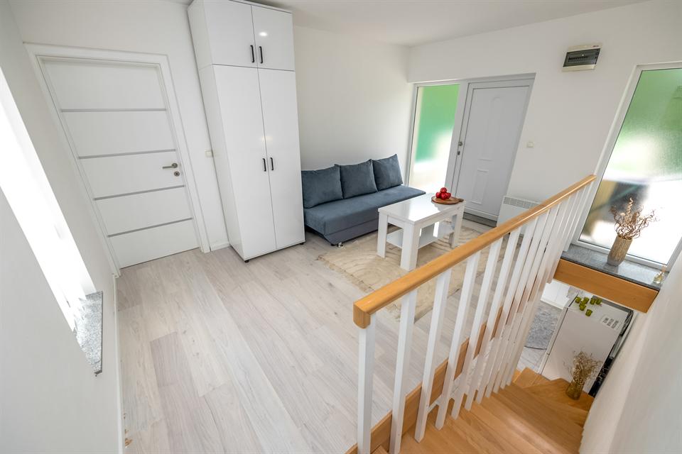 Upper floor sofa lounge with extra sleeping space