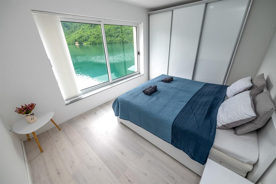 Master bedroom with panoramic lake view